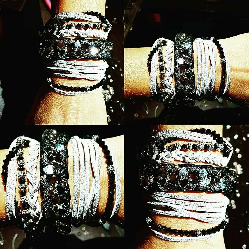 Layered black and white wrap bracelets with braided suede, faceted stones, and metallic beads
