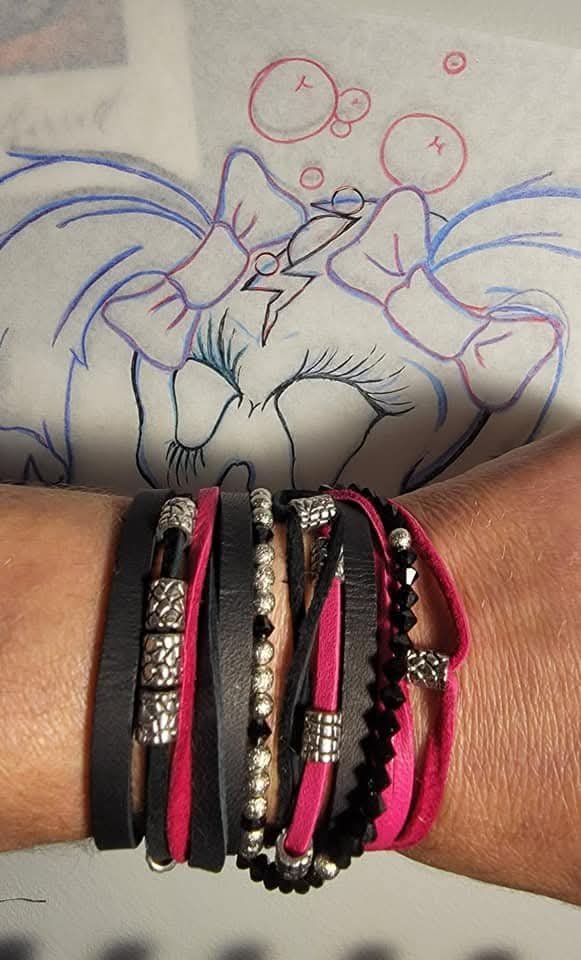 Stacked black, silver, and hot-pink handmade wrap bracelets